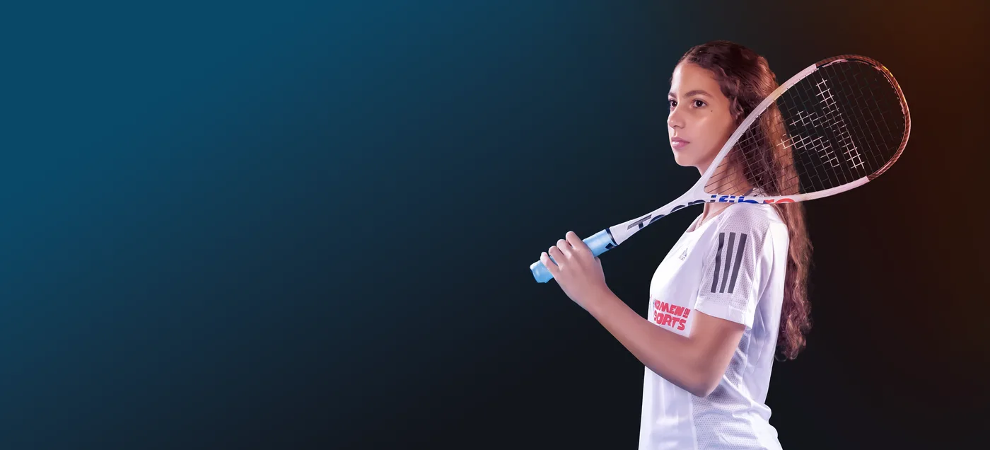 Squash player Malika Taymour lining up a shot